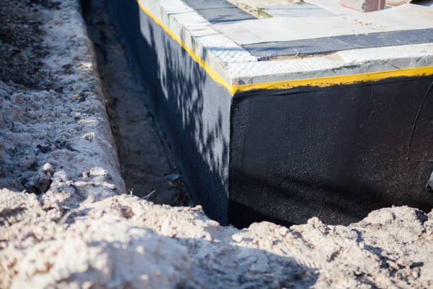 Professional Basement Waterproofing technician working in Allegan, MI